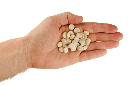 Brewer's yeast in tablets in handの写真素材