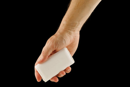 White soap in a man's handの写真素材