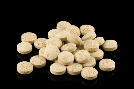 Brewer's yeast in tablets black backgroundの写真素材