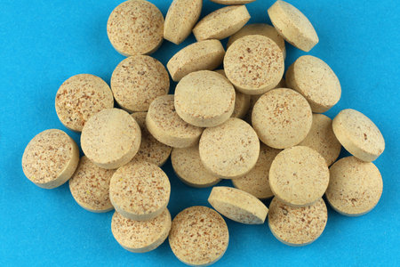 Brewer's yeast in tablets in a heap a lotの写真素材