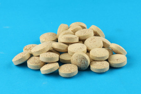 Brewer's yeast in tablets in a heap a lotの写真素材