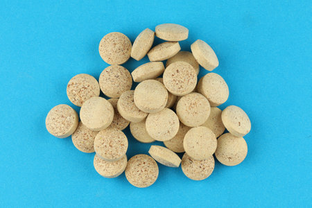 Brewer's yeast in tablets in a heap a lotの写真素材