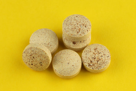 Brewer's yeast in tablets in a heap a lotの写真素材