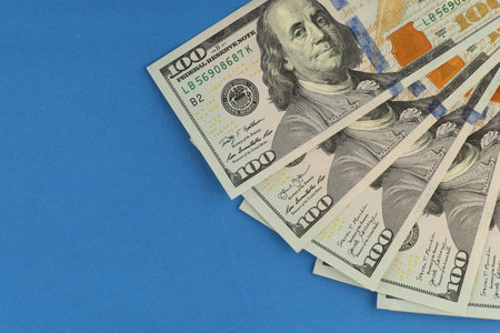 Dollar money on blue background. place for text cope spaceの写真素材