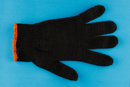 Black mitten for work close-upの写真素材