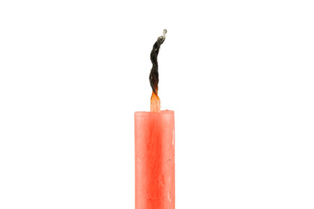 Extinguished candle close-up. Isolateの写真素材