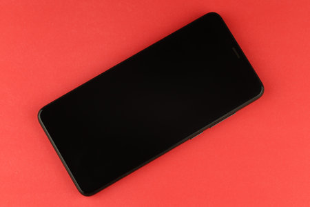 Black smartphone on a colored backgroundの写真素材