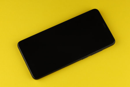 Black smartphone on a colored backgroundの写真素材