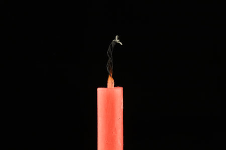 Extinguished candle close-up. Isolateの写真素材
