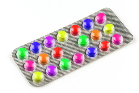 Multicolored vitamin pills in a transparent blisterの写真素材