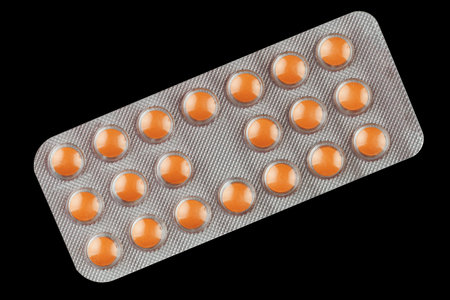 Orange pills in a transparent blisterの写真素材