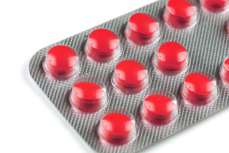 Red pills in a transparent blisterの写真素材