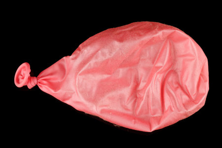 Pink inflated ball with wrinklesの写真素材