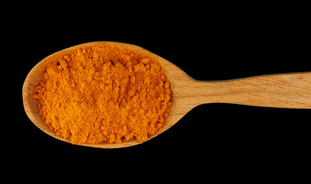 Turmeric curcuma spice in a wooden spoonの写真素材