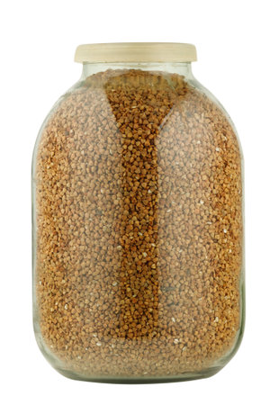 Buckwheat in a glass jar isolateの写真素材