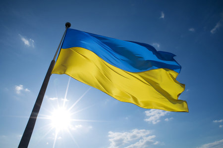 The flag of Ukraine on the background of the blue sky. AI Generatedの素材