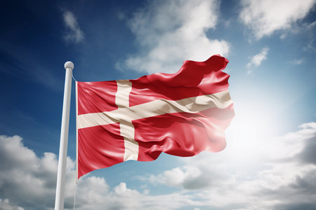 Denmark flag on blue sky backgroundの素材