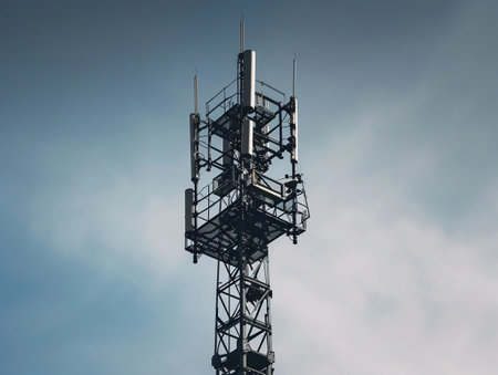 Isolated telecommunication tower with clear blue sky in the backgroundの素材