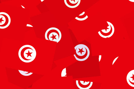 Tunisian flags on a bright backdropの写真素材