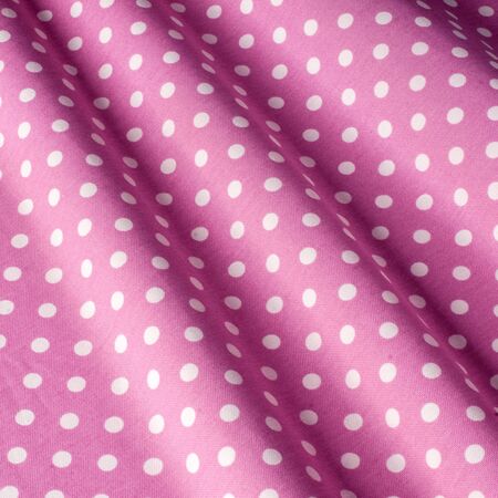 Cotton textile background, pink polka dot fabric. Cotton Provence Fabrics.の写真素材