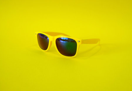 Sunglasses on a yellow background. High quality photoの写真素材