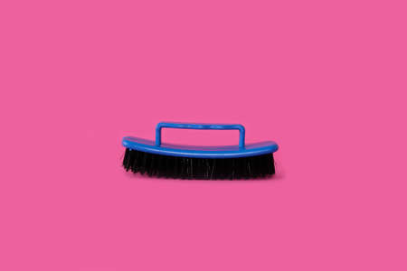 Brush for clothes on a bright pink backgroundの写真素材