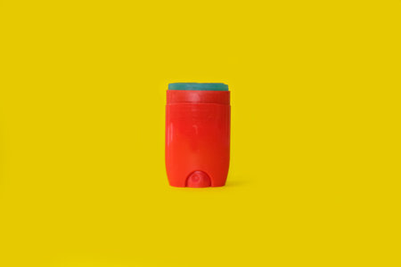 Male deodorant on a bright yellow backgroundの写真素材