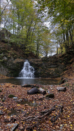 Landscape, waterfall in the forest in autumn, Carpathian Ukraine