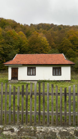 Old houses in the forest in autumn, Carpathian Ukraineの写真素材