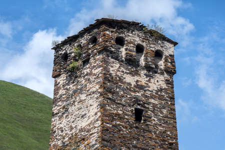 View of the old tower in the high mountainous Georgian villageの写真素材
