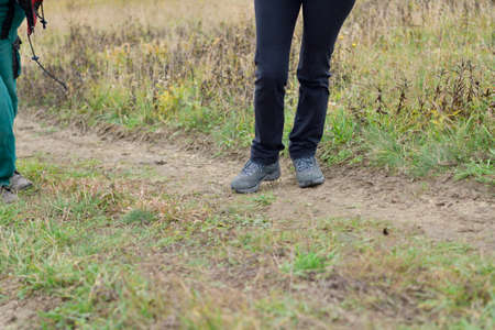 Suitable hiking boots are needed for hiking in the woods in autumn foliage