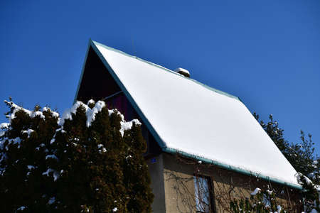 Winter snow idyll with lots of snow in the garden area to relaxの写真素材