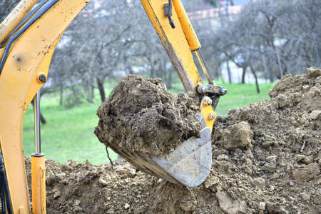 Detail of a shovel excavator that dumps soil while diggingの写真素材