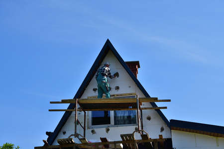 Energy saving by insulating the roof house with white polystyrene