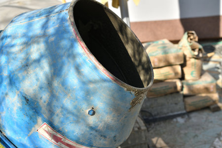 Detail of a hand-held concrete temperer during house constructionの写真素材