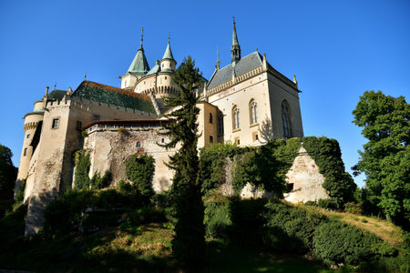 The old walls of the historic castle surrounded by natural waterの写真素材
