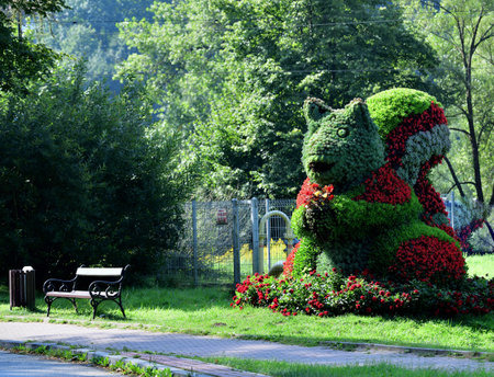 Ornamental decoration and tourist attraction squirrel made of ornamental flowersの写真素材