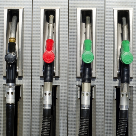 Four refuel nozzles at a petrol or gas station   の写真素材
