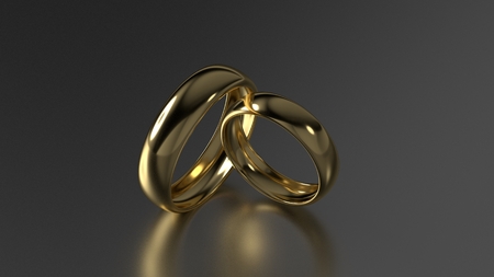 The beauty gold wedding rings on black background. 3d renderingの写真素材