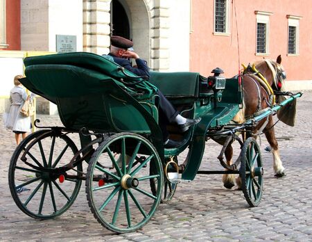 Carriage with a sleeping coachman in Warsaw Old Town.の写真素材
