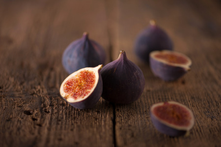 Fresh figues on wooden background