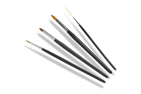 Set of cosmetic brushes, different forms. Isolated on white background. Top view. Cosmetics and beauty concept. Copy spaceの写真素材