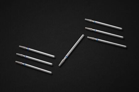 Set of diamond cosmetic bits for skins, manicure, pedicure, healing pedicures, modeling hardened gel or acrylic. Black backgroundの写真素材