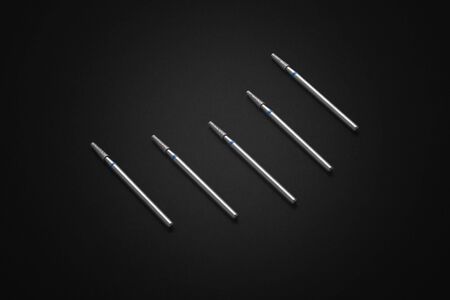 Set of diamond cosmetic bits for skins, manicure, pedicure, healing pedicures, modeling hardened gel or acrylic. Black background. Accessories of electrical manicure and pedicure drillsの写真素材