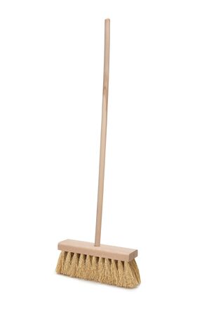 Broom with long wooden handle isolated on white background. Cleaning equipment for houseworkの写真素材