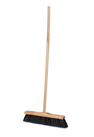 Broom with long wooden handle isolated on white background. Cleaning equipment for houseworkの写真素材