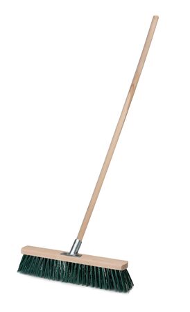 Broom with long wooden handle isolated on white background. Cleaning equipment for houseworkの写真素材