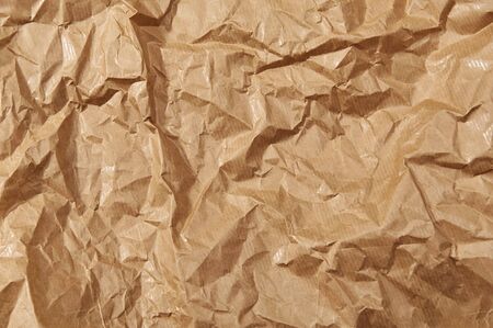 Crumpled brown paper textured and background. Craft paper background. Brown paper rumple with texturedの写真素材