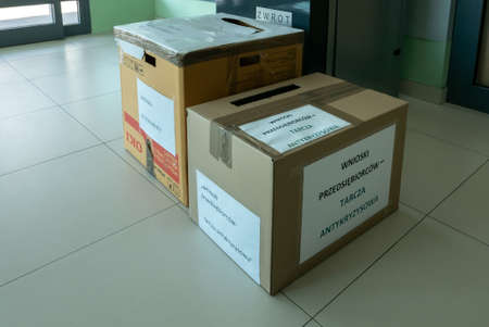 LUBLIN, POLAND - 8 April 2020: 'Anti-crisis shield' box in Polish Social Insurance Institution during coronavirus (COVID-19) pandemic. Box is for entrepreneurs who want get government economic helpのeditorial素材
