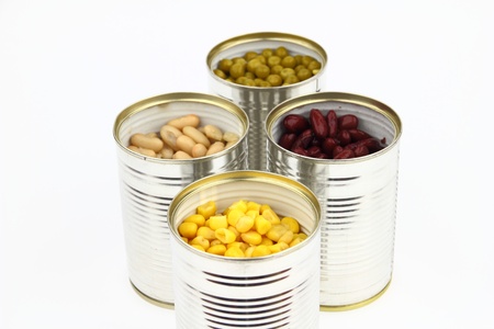 The tins with peas, bean, red bean, corn on the white backgroundの写真素材